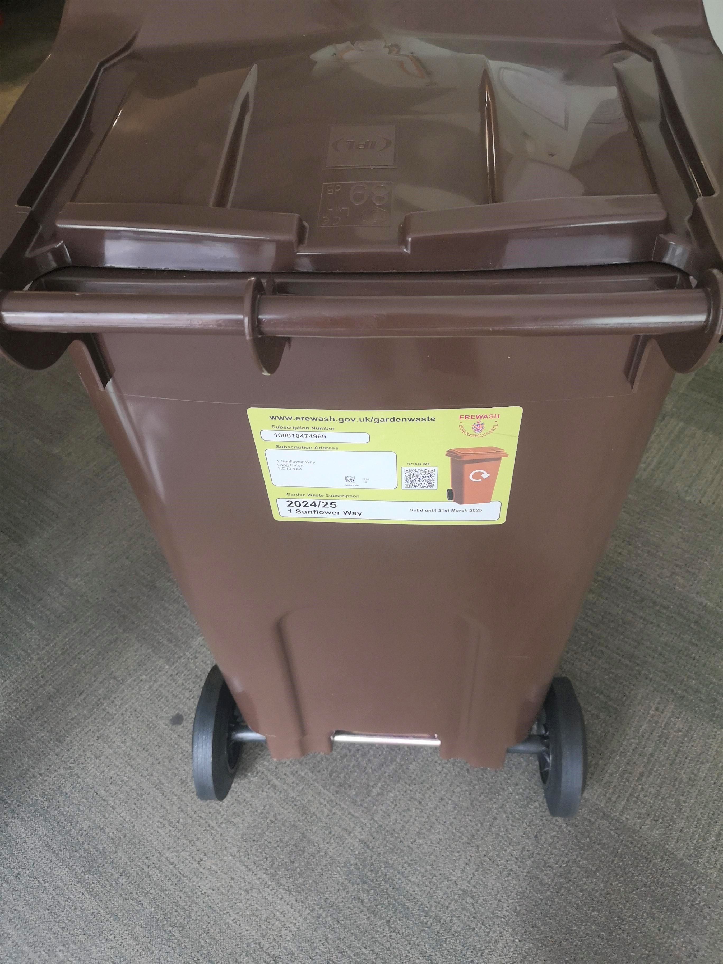 A brown bin with the Bin Sticker placed in the correct place