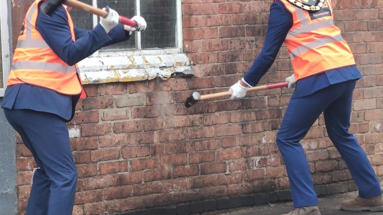 Richard Ledger and Mayor, right, with sledgehammers