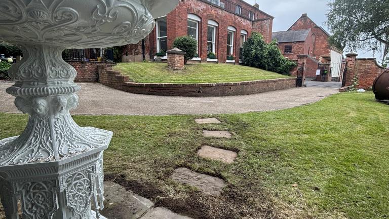 The Handyside Urn in the museum's garden, with Erewash Museum in the background