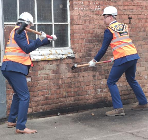 Richard Ledger and Mayor, right, with sledgehammers