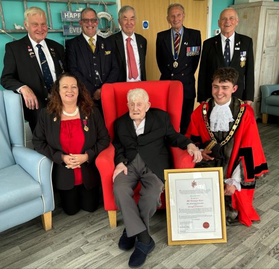 Donald Rose with the delegation and his certificate