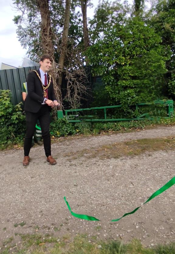 Harry cuts the ribbon
