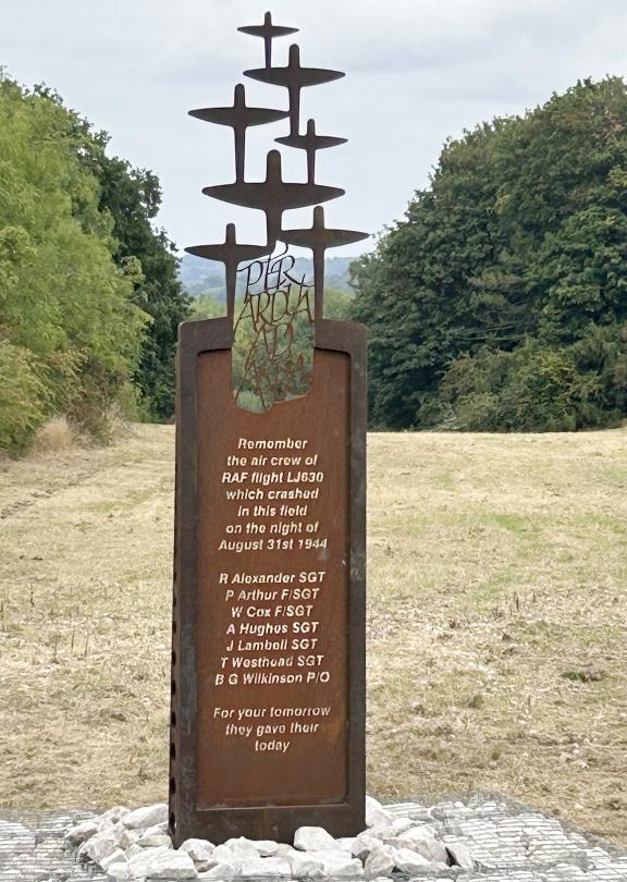 The memorial which is bronze and has bombers on top
