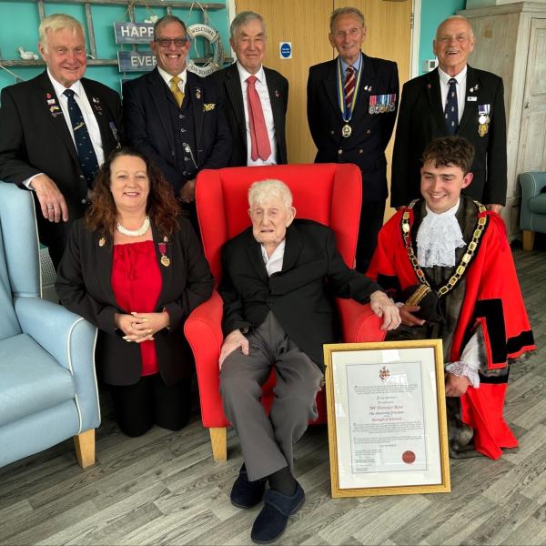 Donald Rose with the delegation and his certificate